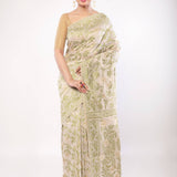 Off - White Jamdani Saree with All - Over Green and Gold Floral Motifs - Anvi Couture