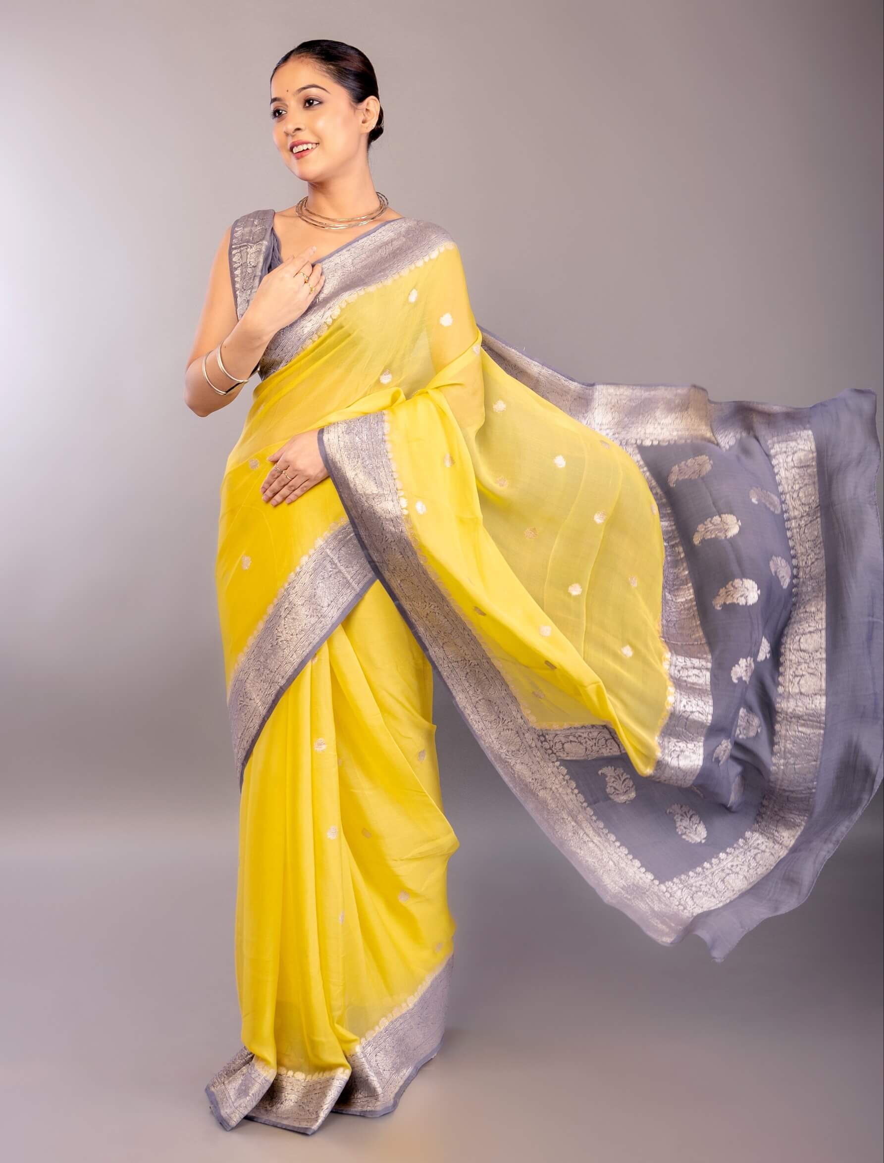 Yellow Khaddi Georgette Banarasi Saree with Contrasting Gray Zari Border - Anvi Couture
