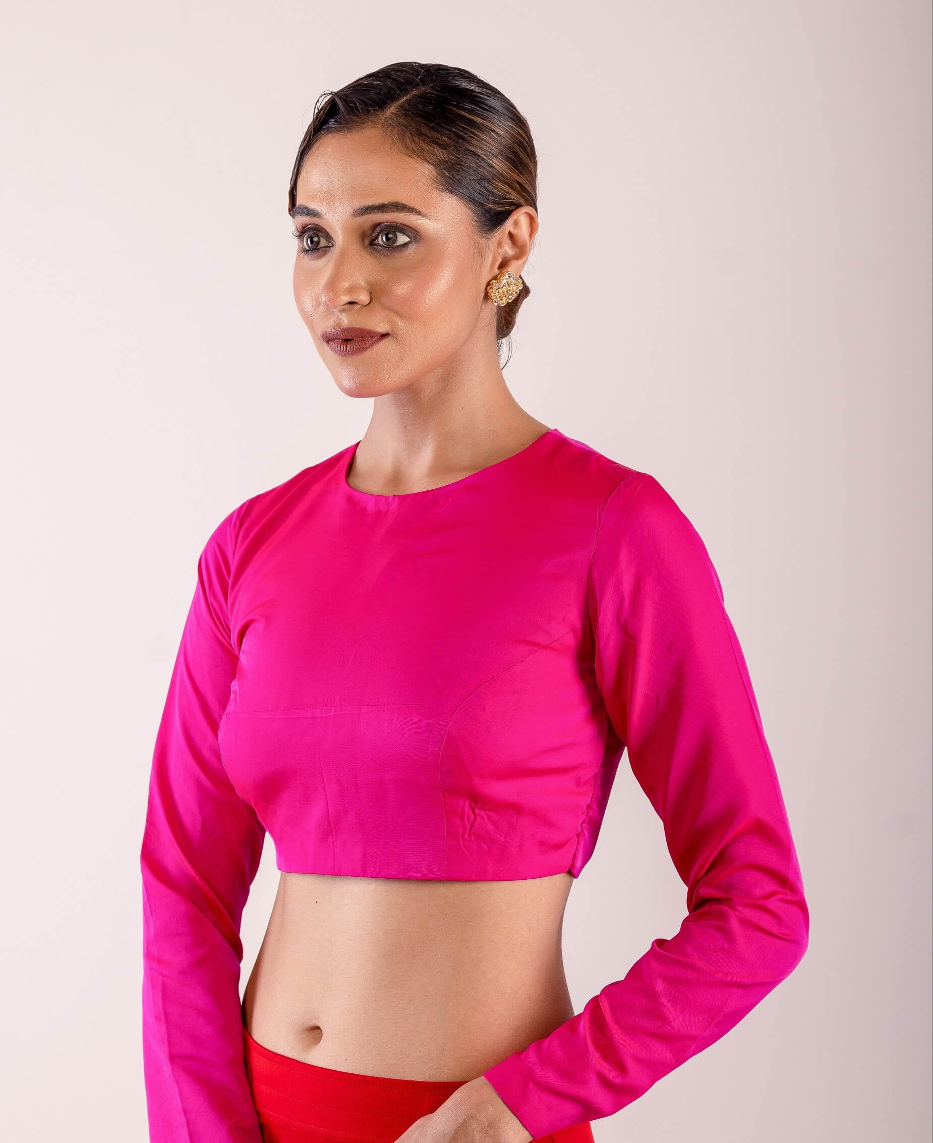 A woman dressed in a Rani Pink Full Sleeve Formal Blouse with High Neck- Elegant Workwear Essential for Women - Anvi Couture - Image 3