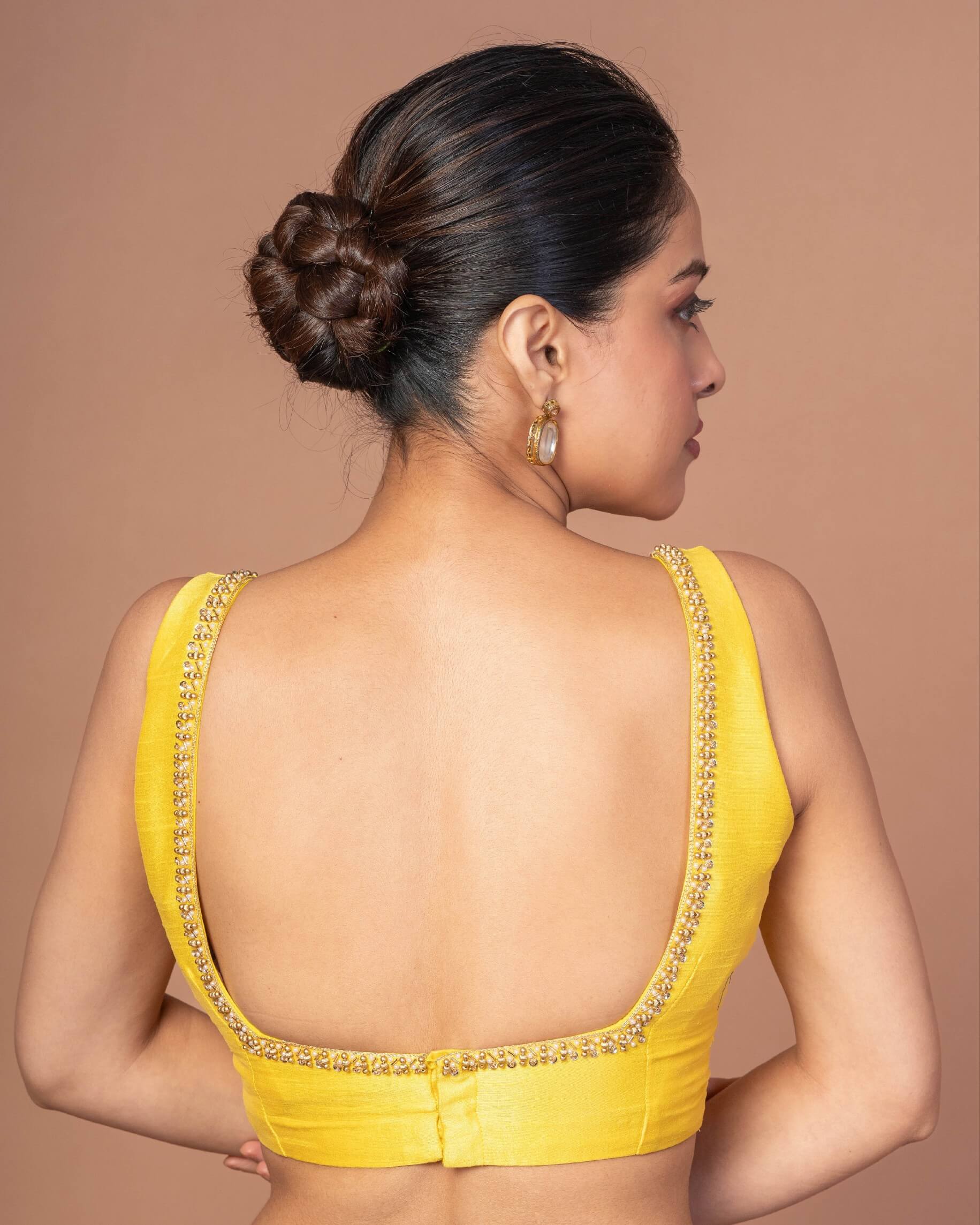 Woman Wearing a Yellow Raw Silk Cut Dana Embroidered U Neck Sleeveless Blouse: Anvi Couture - Image 4