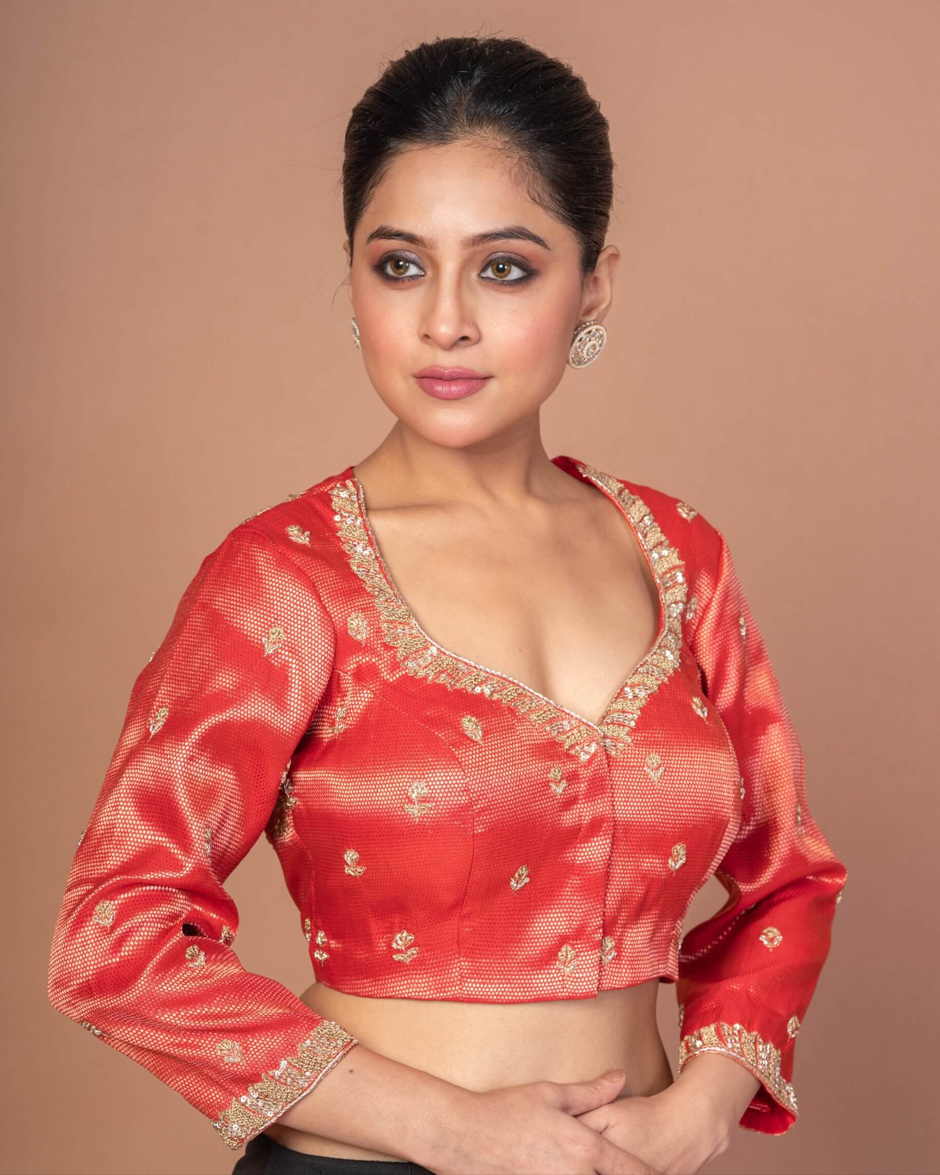 A Woman Wearing Red Tissue Silk Blouse with Hand Embroidered Work: Bridal Wear, Festive Wear Blouse - Anvi Couture - Image 3