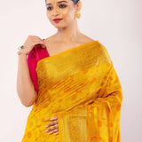 Yellow Art Silk Saree with Gold Zari Border and Orange Floral Motifs - Anvi Couture