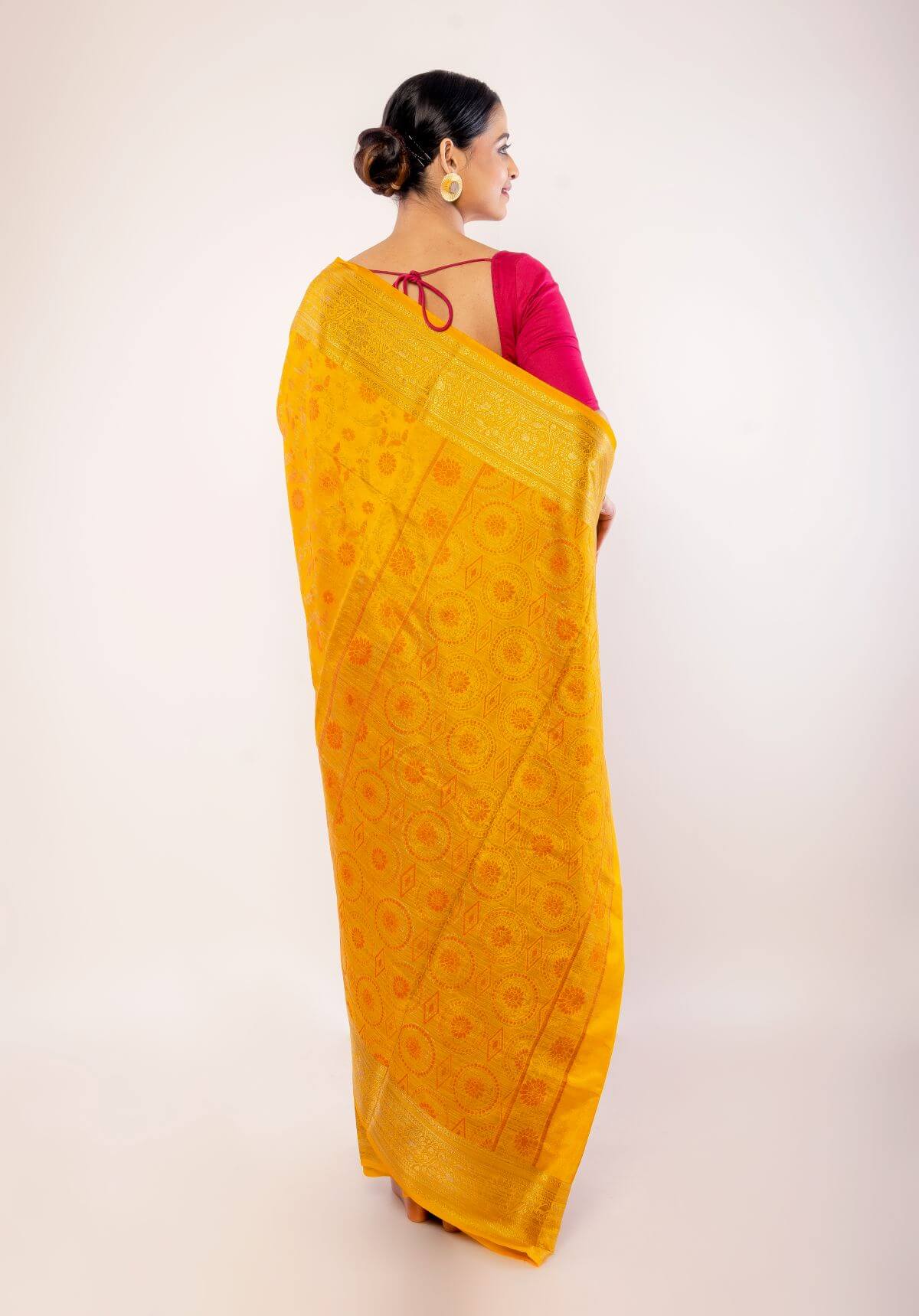 Yellow Art Silk Saree with Gold Zari Border and Orange Floral Motifs - Anvi Couture