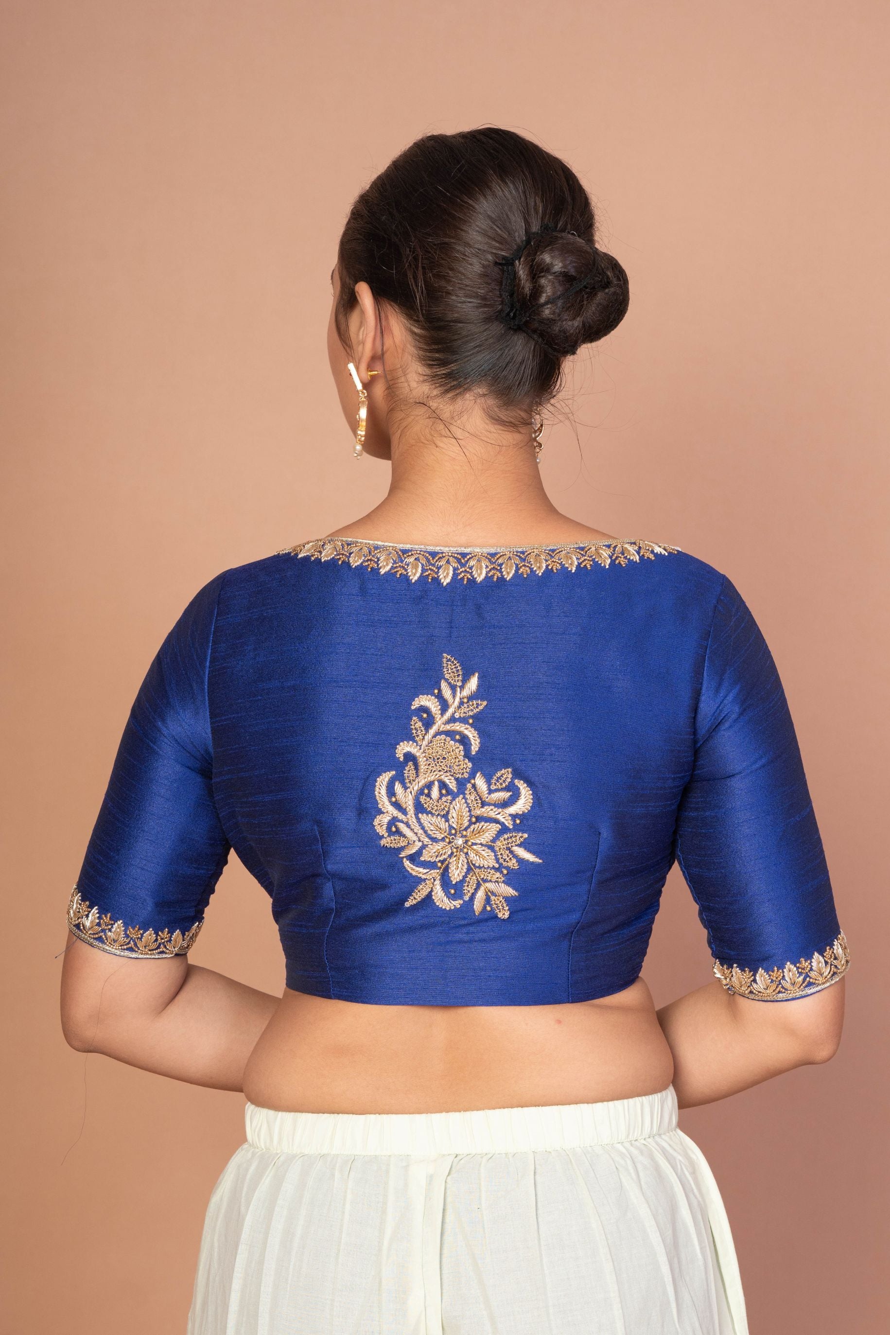Blue Hand-Embroidered Blouse with Round Neck and Back Closure
image 3
