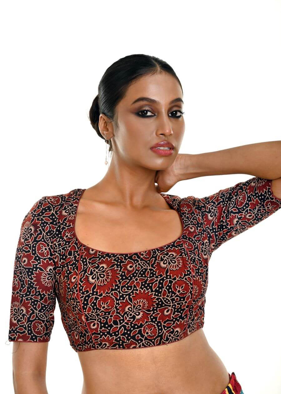 Close-up of handcrafted maroon and black Ajrakh print pure cotton saree blouse with ethnic design