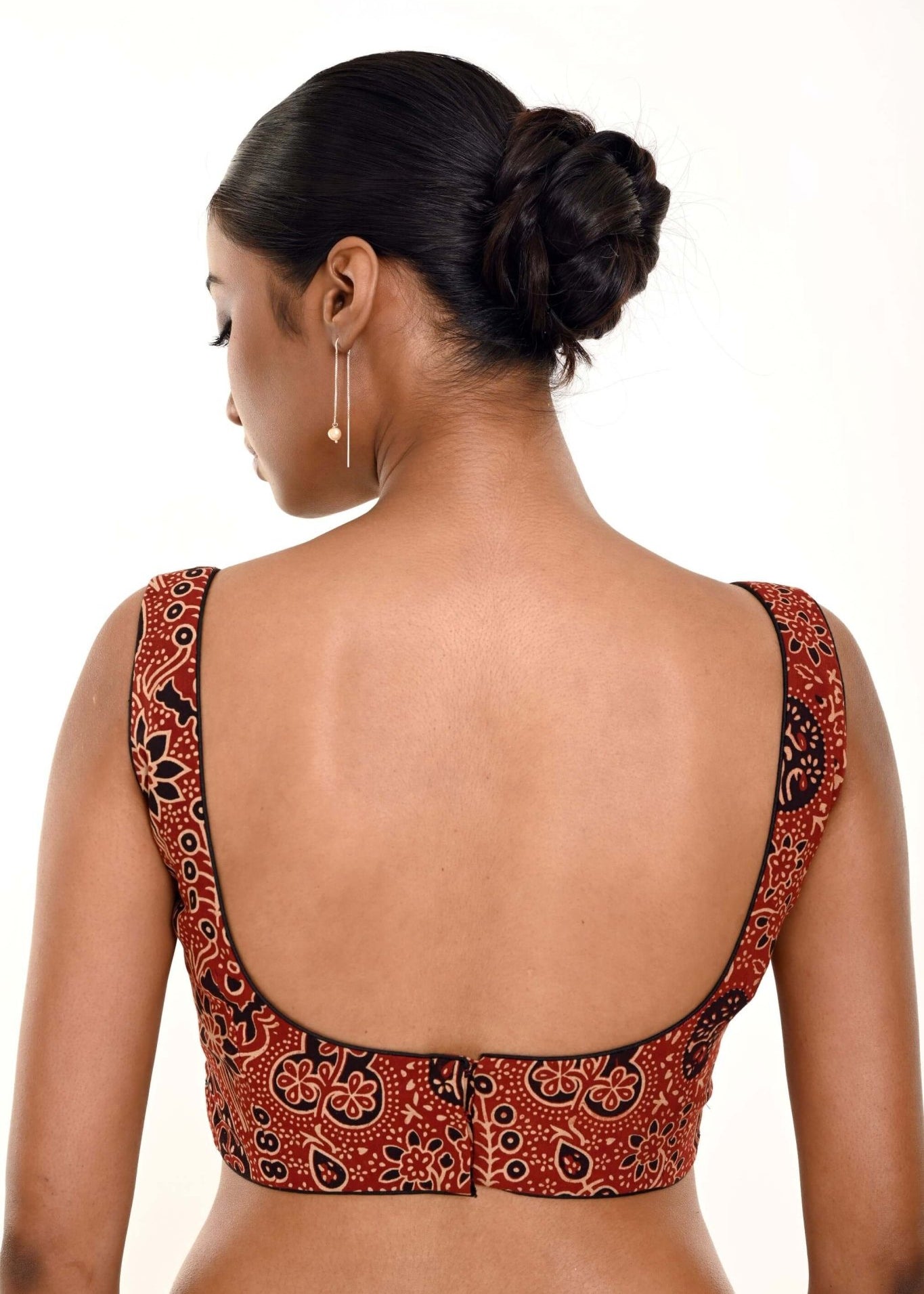 A Woman Wearing a Maroon Ajrakh Print Pure Cotton Sleeveless Blouse with Sweetheart Neckline - Anvi Couture - Image 4