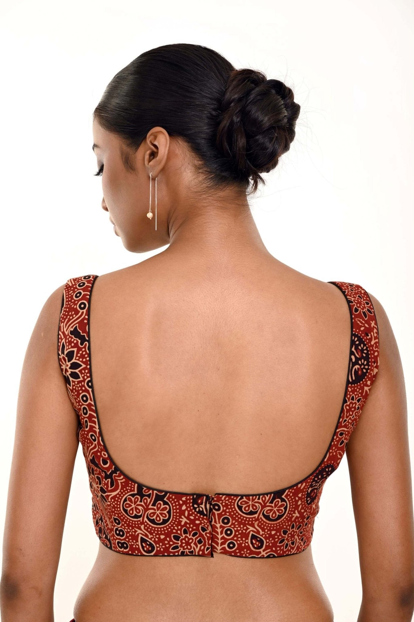A Woman Wearing a Maroon Ajrakh Print Pure Cotton Sleeveless Blouse with Sweetheart Neckline - Anvi Couture - Image 4