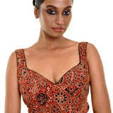 A Woman Wearing a Maroon Ajrakh Pure Cotton Sleeveless Blouse with Sweetheart Neckline - Anvi Couture - Image 1