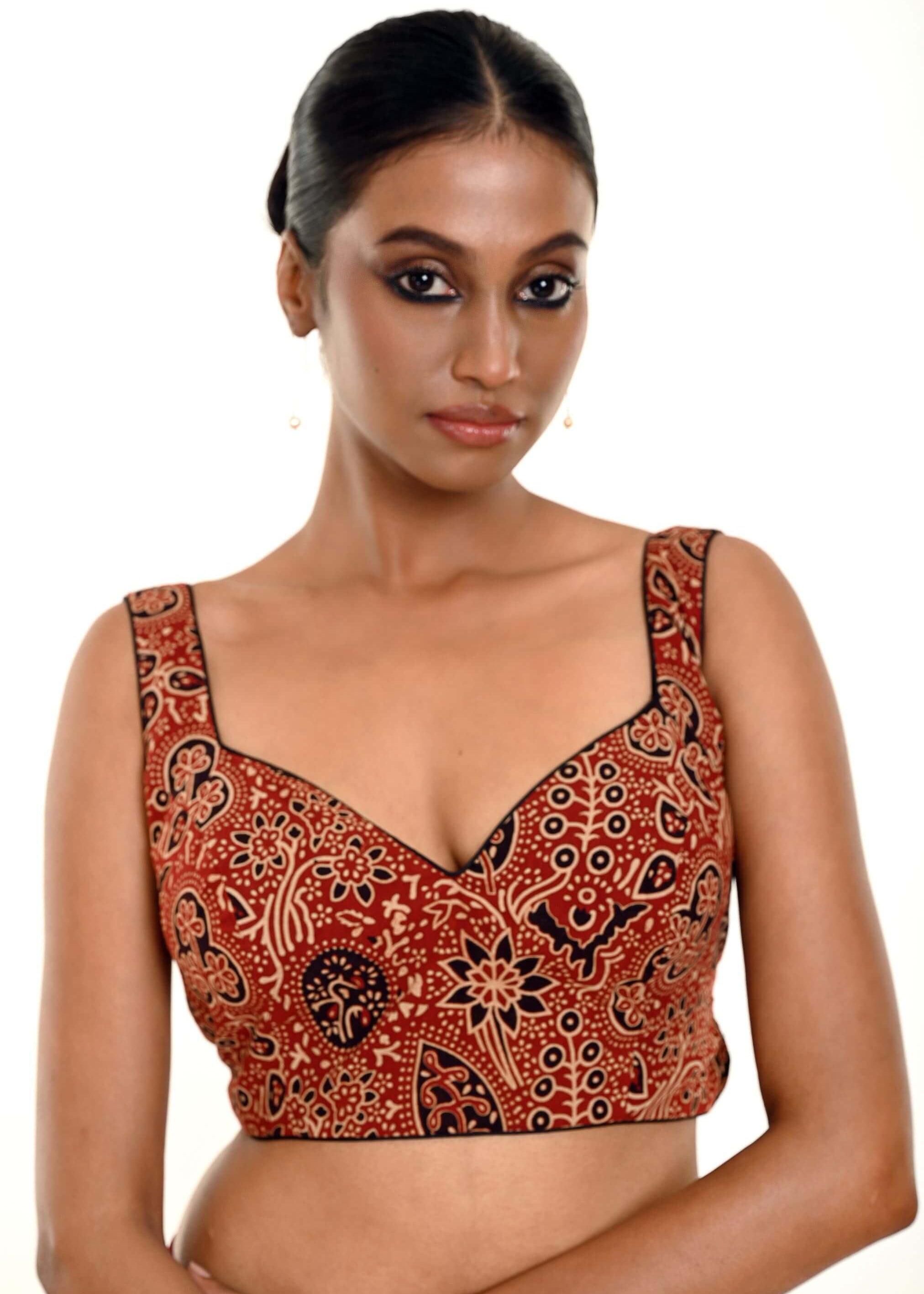 A Woman Wearing a Maroon Ajrakh Pure Cotton Sleeveless Blouse with Sweetheart Neckline - Anvi Couture - Image 1