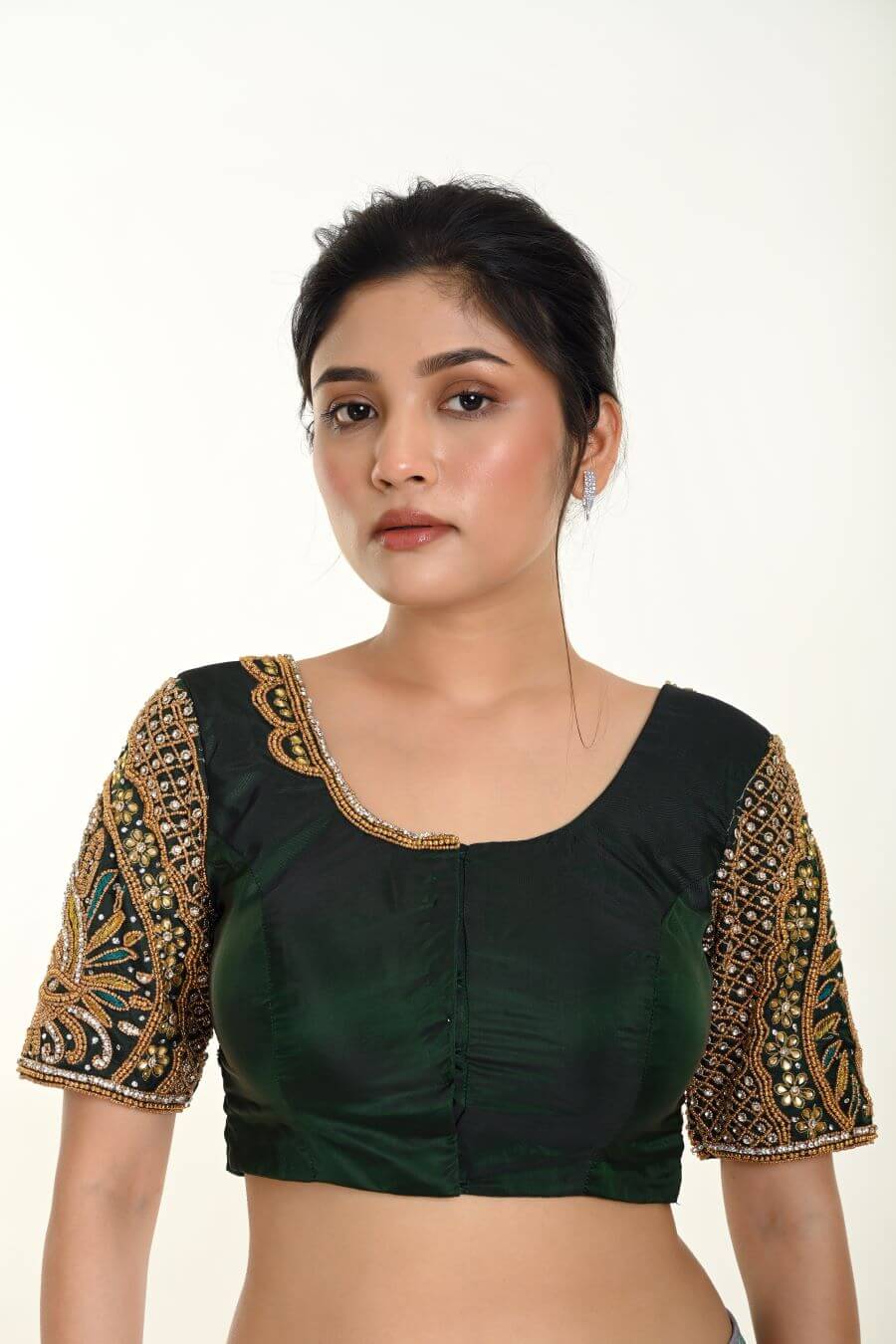 A Woman Wearing a Green Bridal Blouse in Pure Silk with Maggam Zardozi Work: Bridal Blouse - Anvi Couture - Image 1