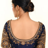 A Woman Wearing a Royal Blue Heavy Aari Work Embroidery Bridal Blouse in Pure Silk - Anvi Couture - Image 2