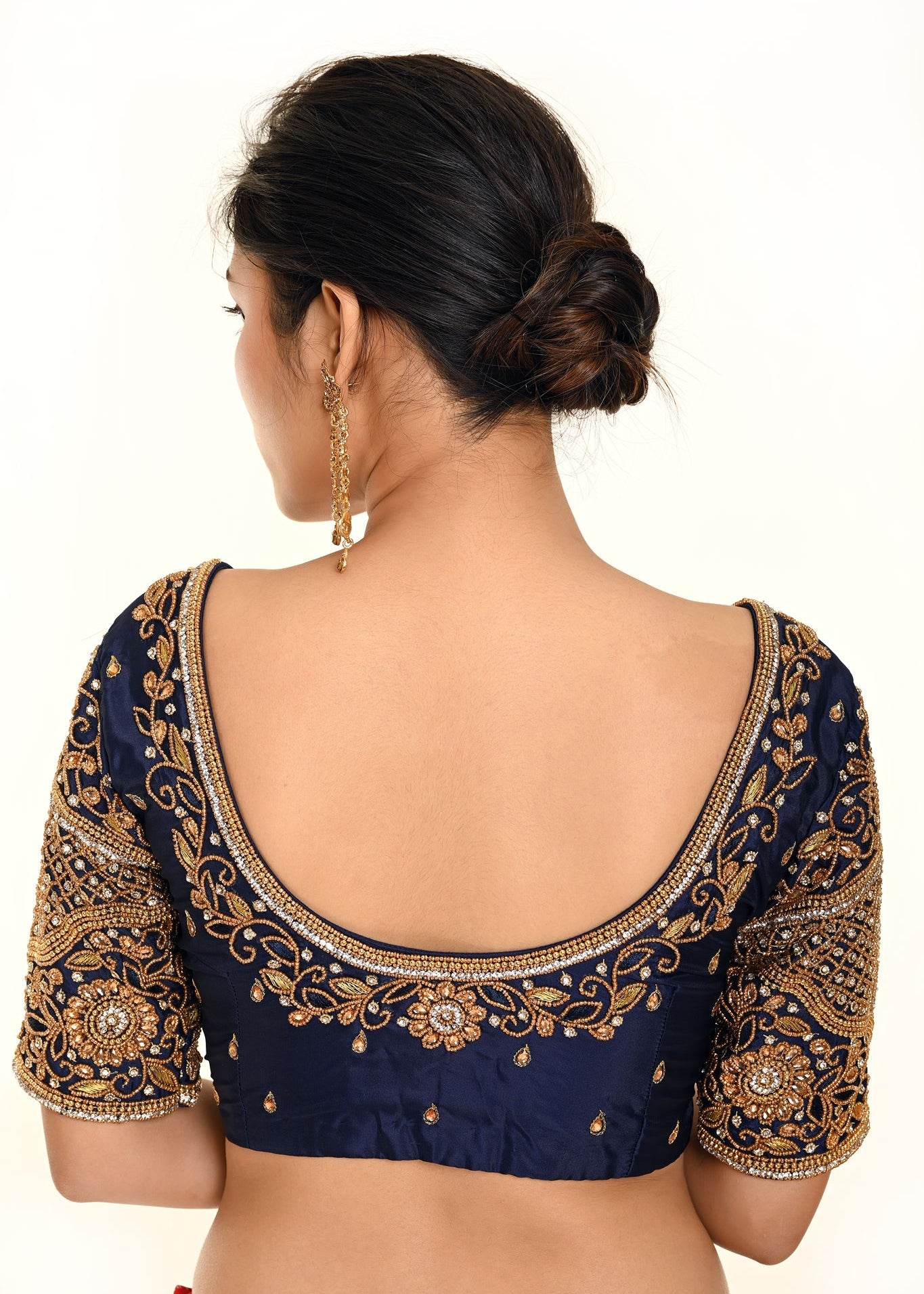 A Woman Wearing a Royal Blue Heavy Aari Work Embroidery Bridal Blouse in Pure Silk - Anvi Couture - Image 2