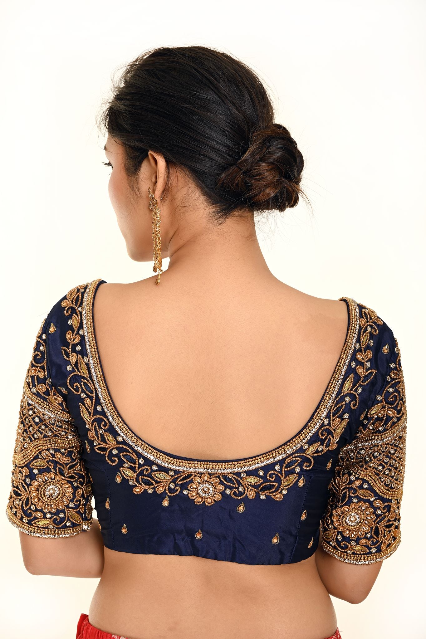 A Woman Wearing a Royal Blue Heavy Aari Work Embroidery Bridal Blouse in Pure Silk - Anvi Couture - Image 2