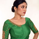 A Woman Wearing an Aari Work Blouse in Green Color made from Pure Silk - Bridal Blouse, Festive Blouse - Anvi Couture: Image 3