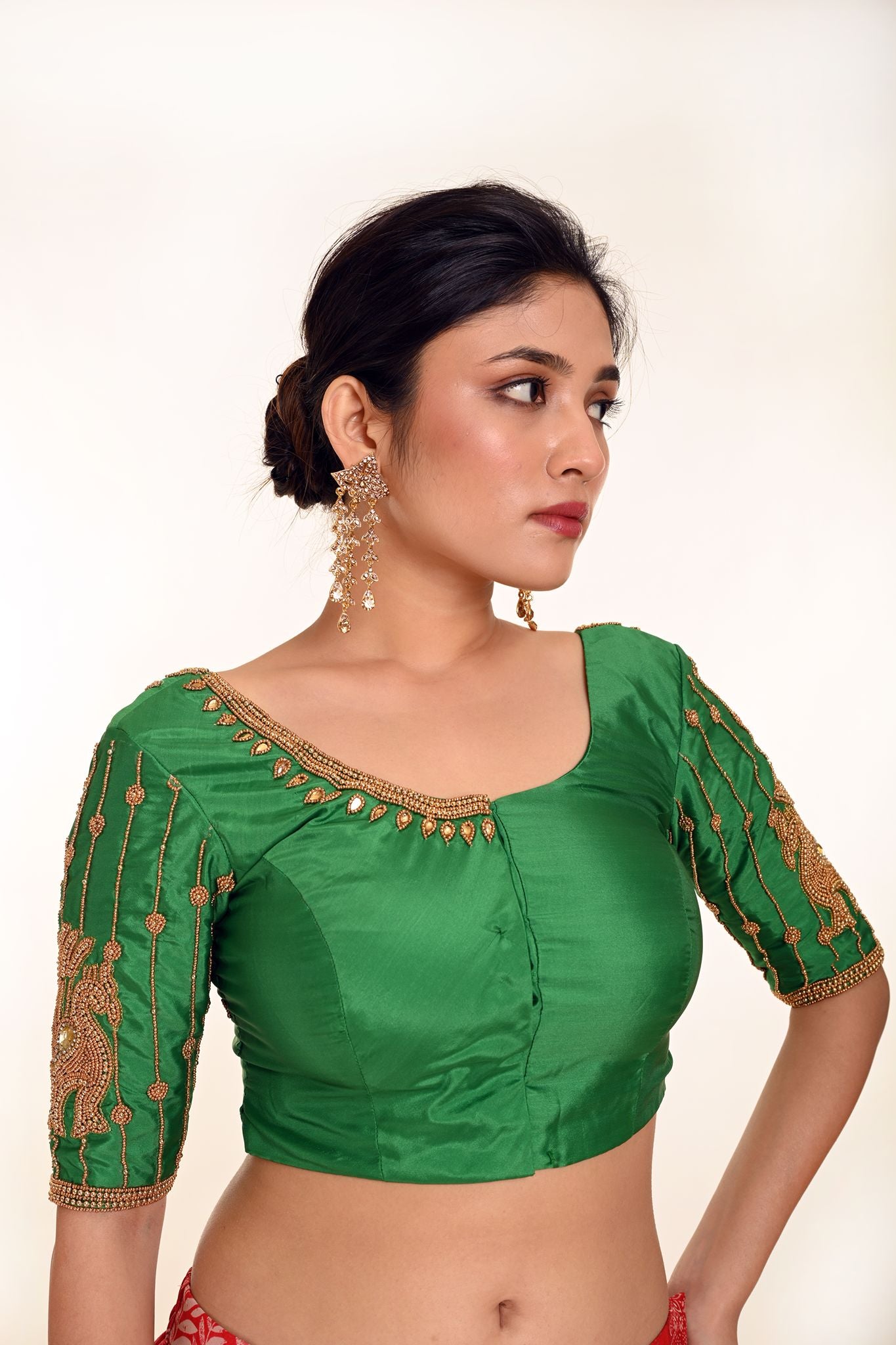 A Woman Wearing an Aari Work Blouse in Green Color made from Pure Silk - Bridal Blouse, Festive Blouse - Anvi Couture: Image 3