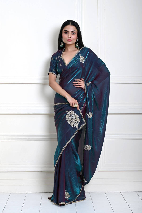 Teal blue organza silk saree with all-over hand embroidery — full drape front view
