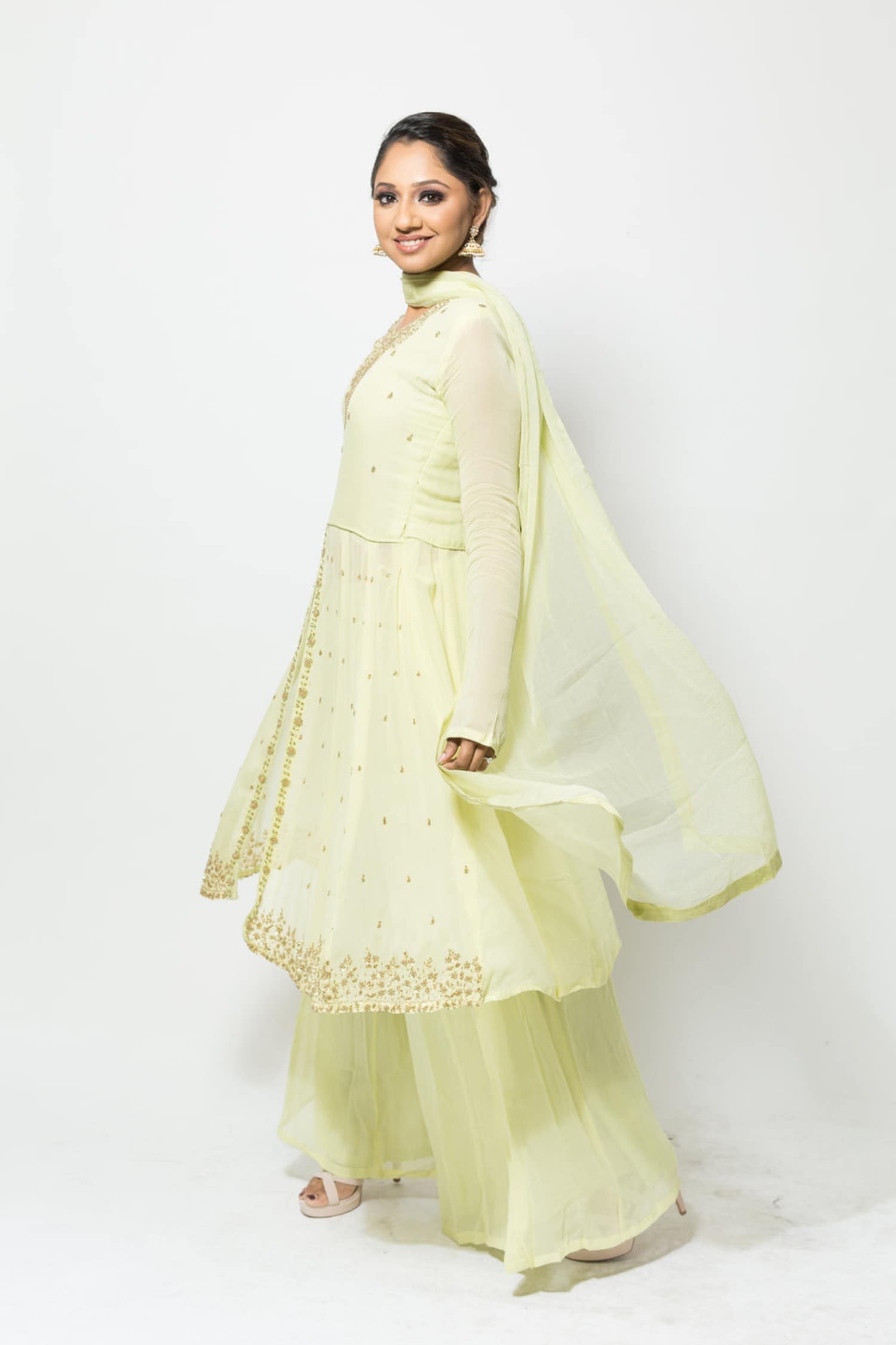 Festive light green georgette Sharara set with embroidered Kurta, round neck, and flowing design