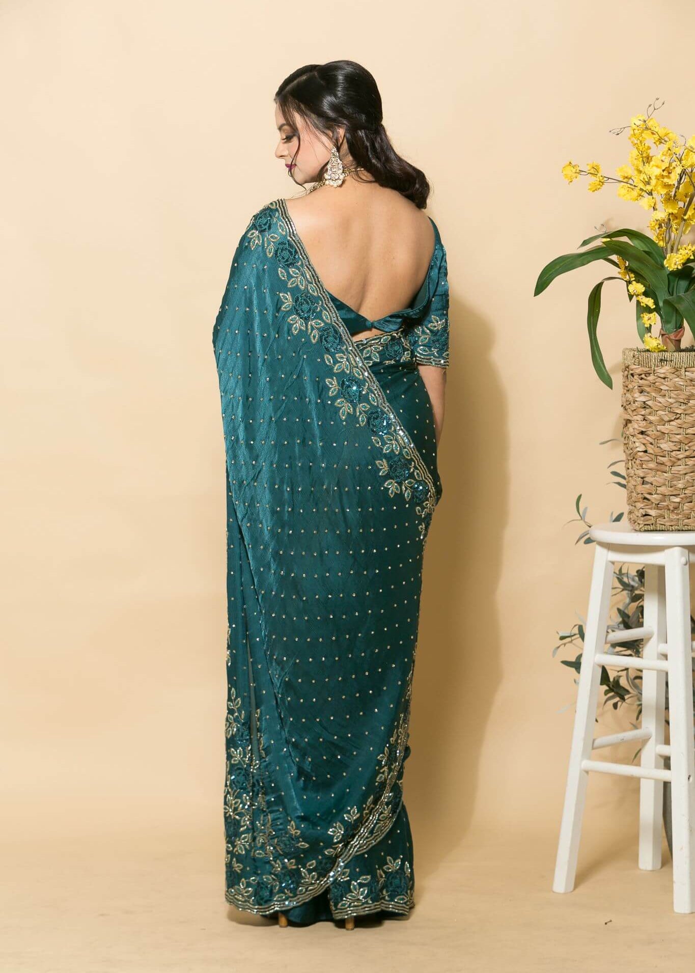Teal Blue Crepe Saree with stonework and floral embroidery - Anvi Couture