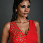Front view of red hand embroidered sleeveless georgette blouse with V-neckline 