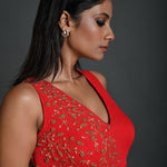 Side profile of lightweight red georgette sleeveless blouse featuring detailed embroidery