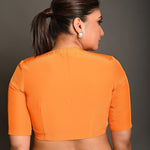 Bright Orange Blouse with Plunging Curved V - Neckline and Half Sleeves - Anvi Couture