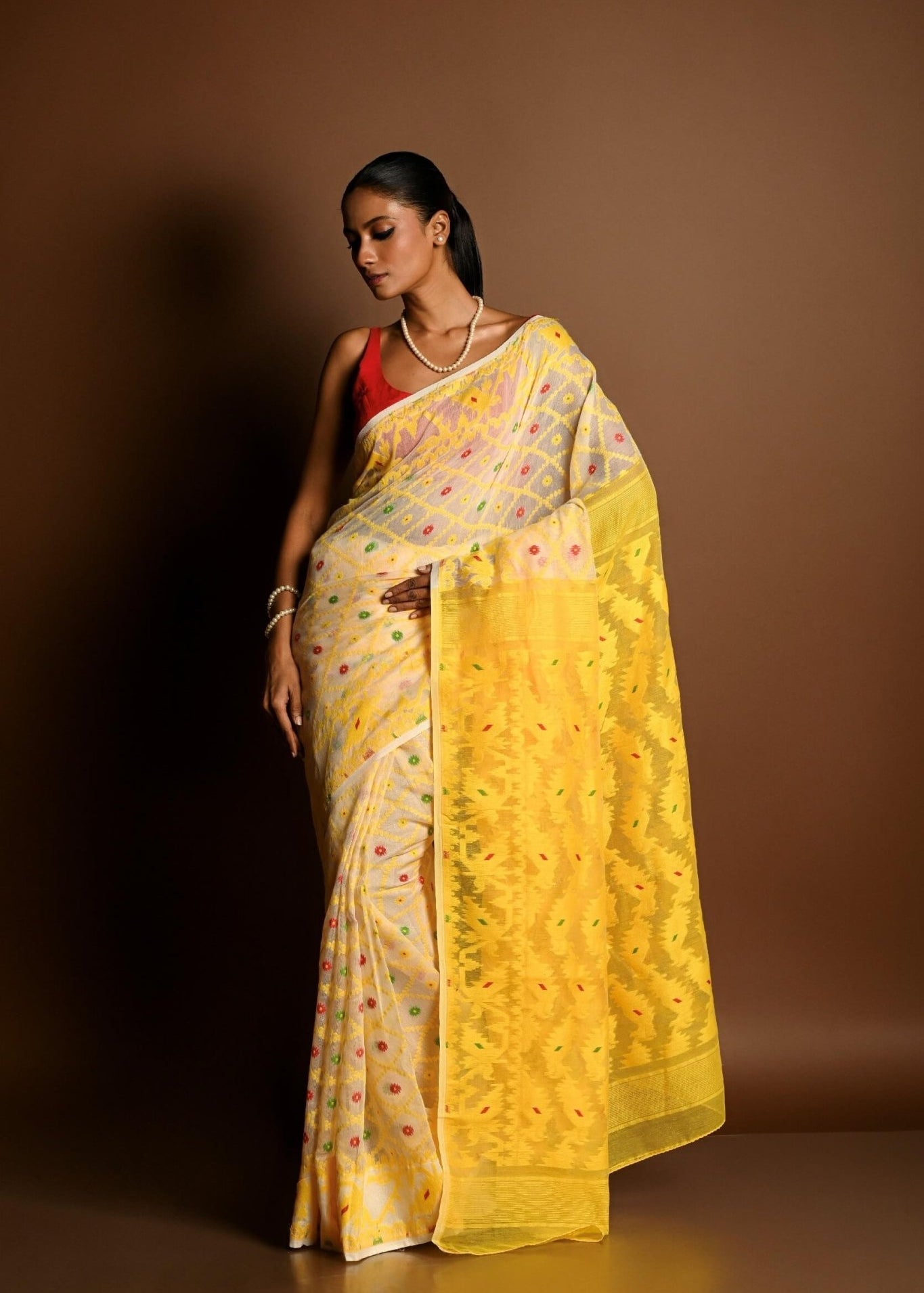 Yellow Pure Tant Jamdani Saree with All Over Red and Green Buta - Anvi Couture