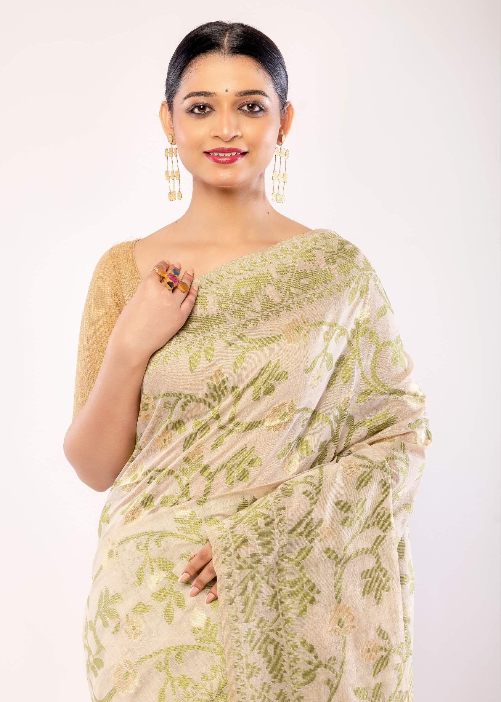 Off - White Jamdani Saree with All - Over Green and Gold Floral Motifs - Anvi Couture