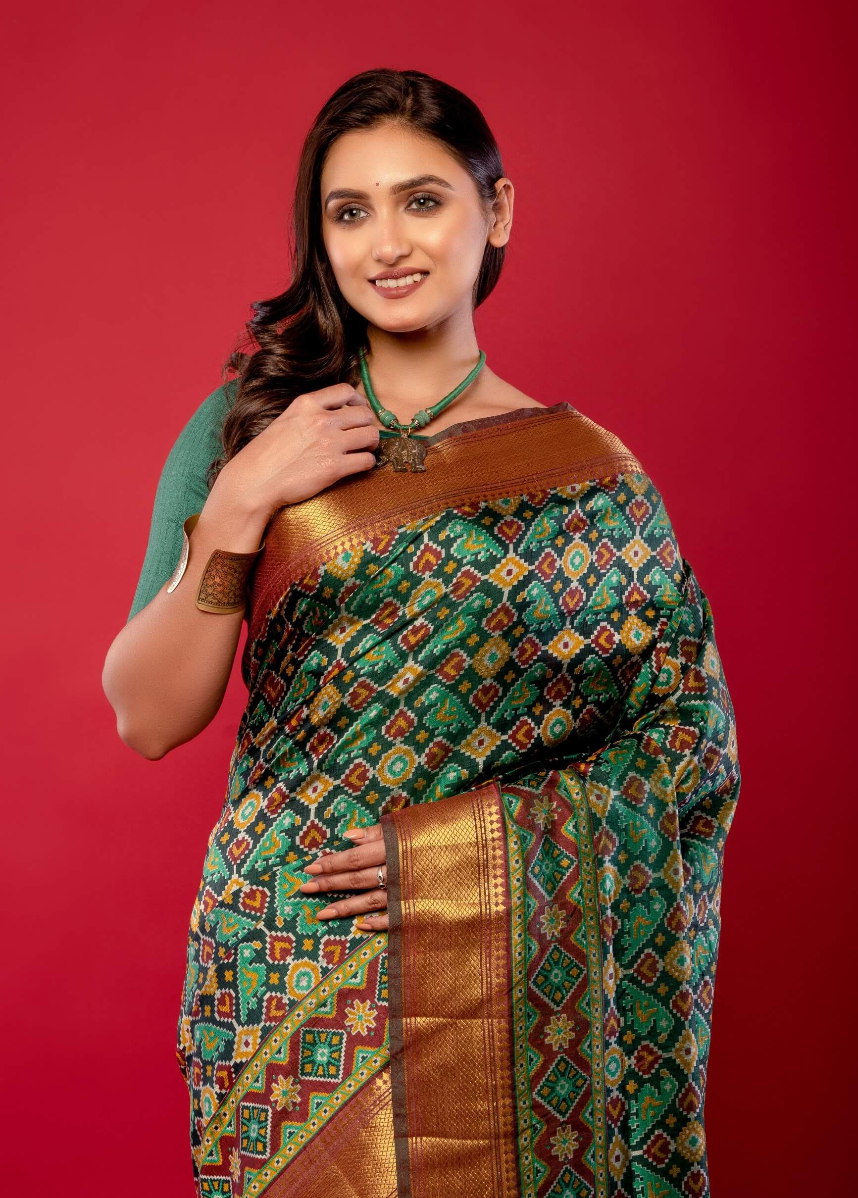Green Patola Silk Saree with Contrasting Maroon and Gold Zari Border - Anvi Couture