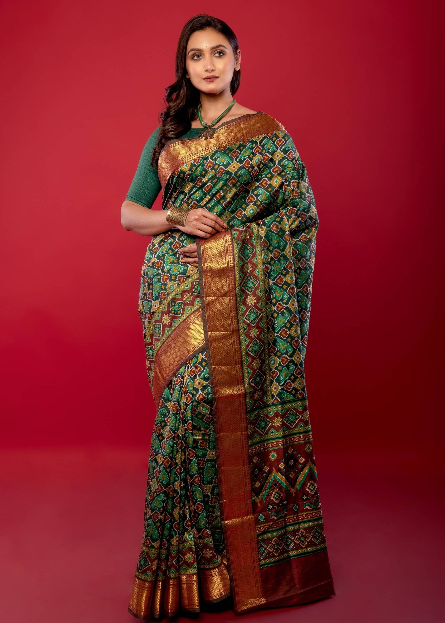 Green Patola Silk Saree with Contrasting Maroon and Gold Zari Border - Anvi Couture