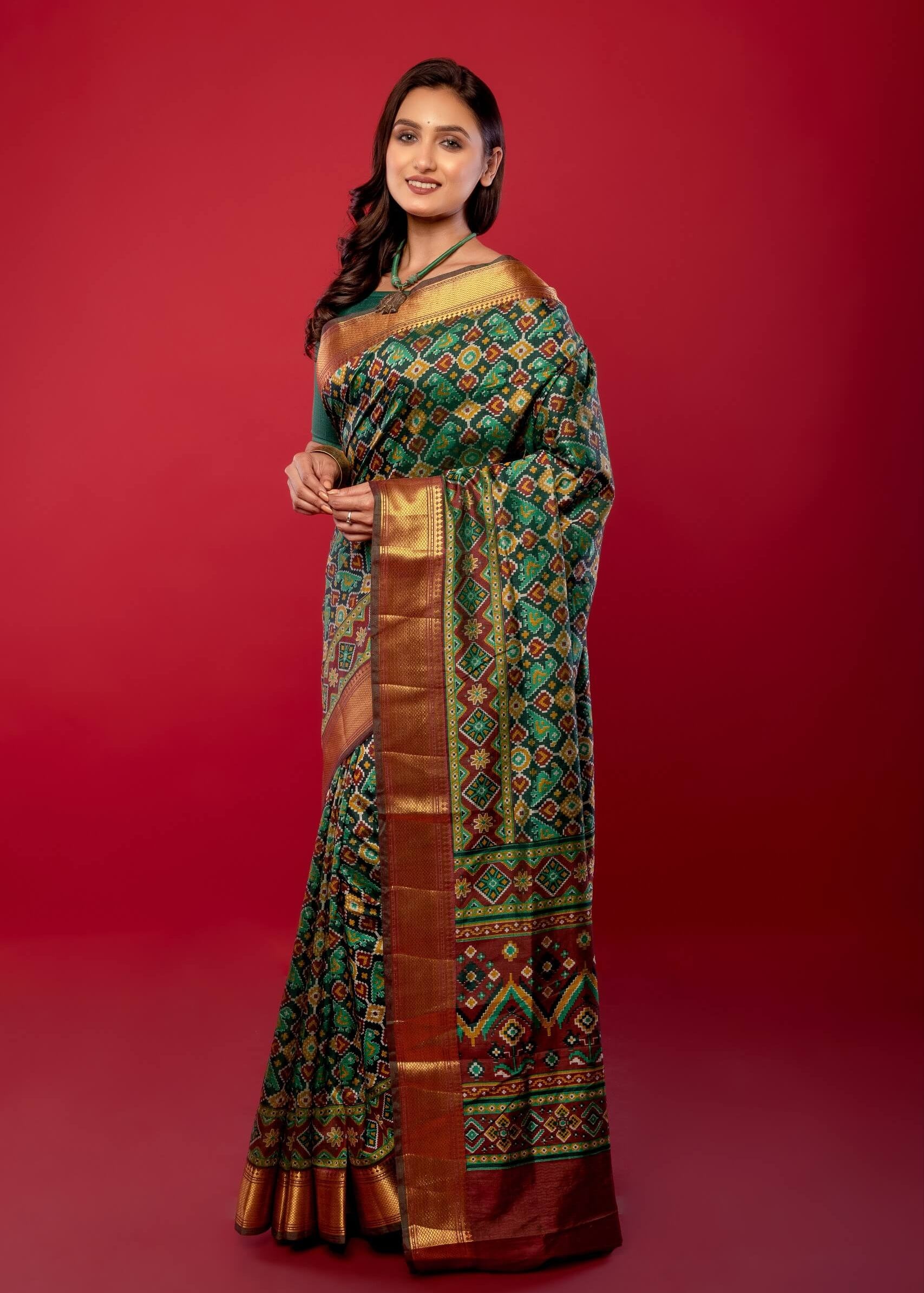 Green Patola Silk Saree with Contrasting Maroon and Gold Zari Border - Anvi Couture