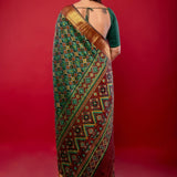 Green Patola Silk Saree with Contrasting Maroon and Gold Zari Border - Anvi Couture