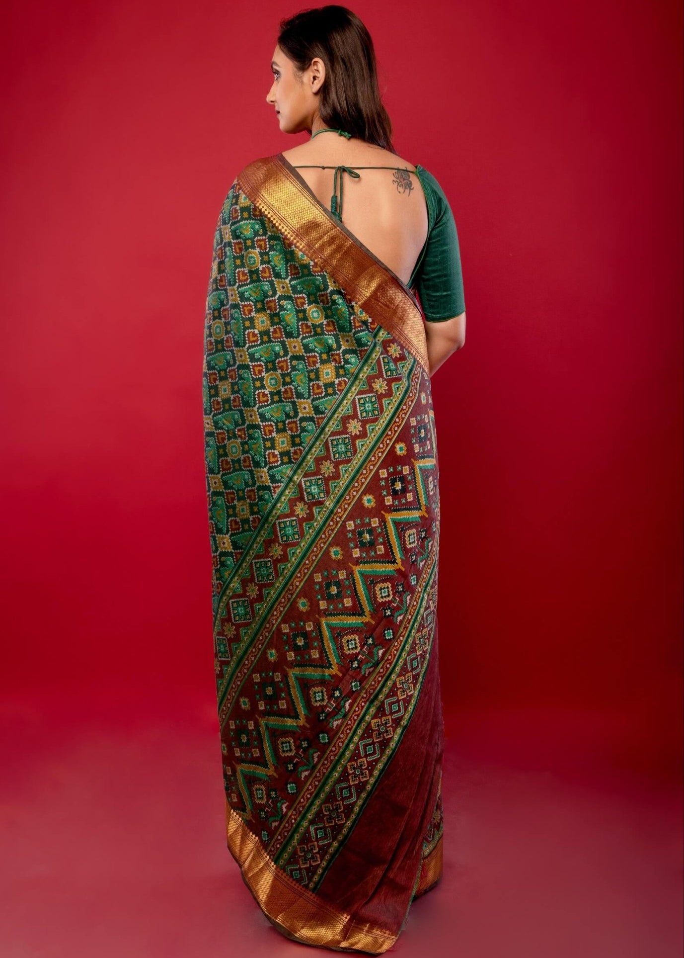 Green Patola Silk Saree with Contrasting Maroon and Gold Zari Border - Anvi Couture
