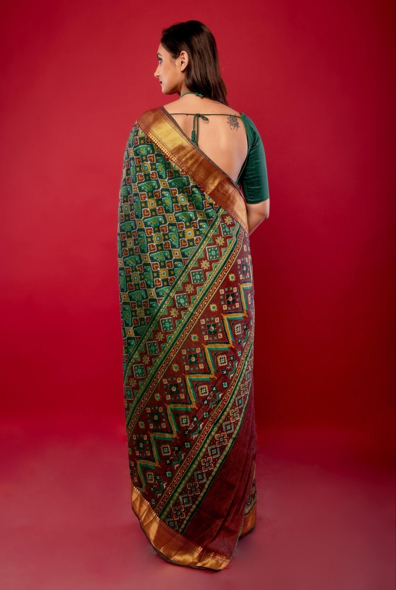 Green Patola Silk Saree with Contrasting Maroon and Gold Zari Border - Anvi Couture