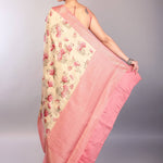Cream White Silk Saree with Floral Prints and Contrasting Pink Zari Border - Anvi Couture