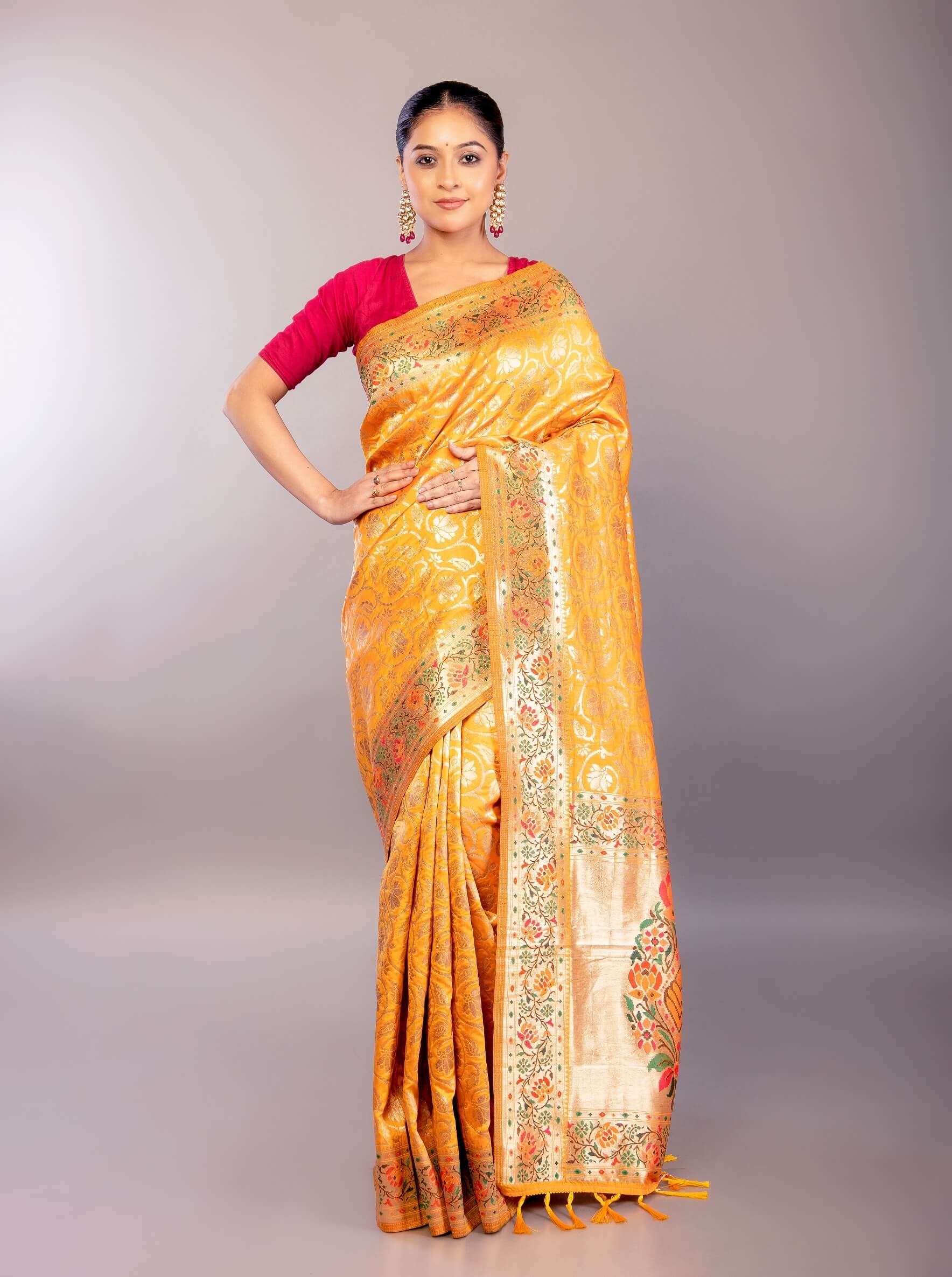 A Woman Wearing a Yellow Paithani Silk Saree with Gold Zari Floral Jaal Work: Bridal Saree - Anvi Couture - Image 1