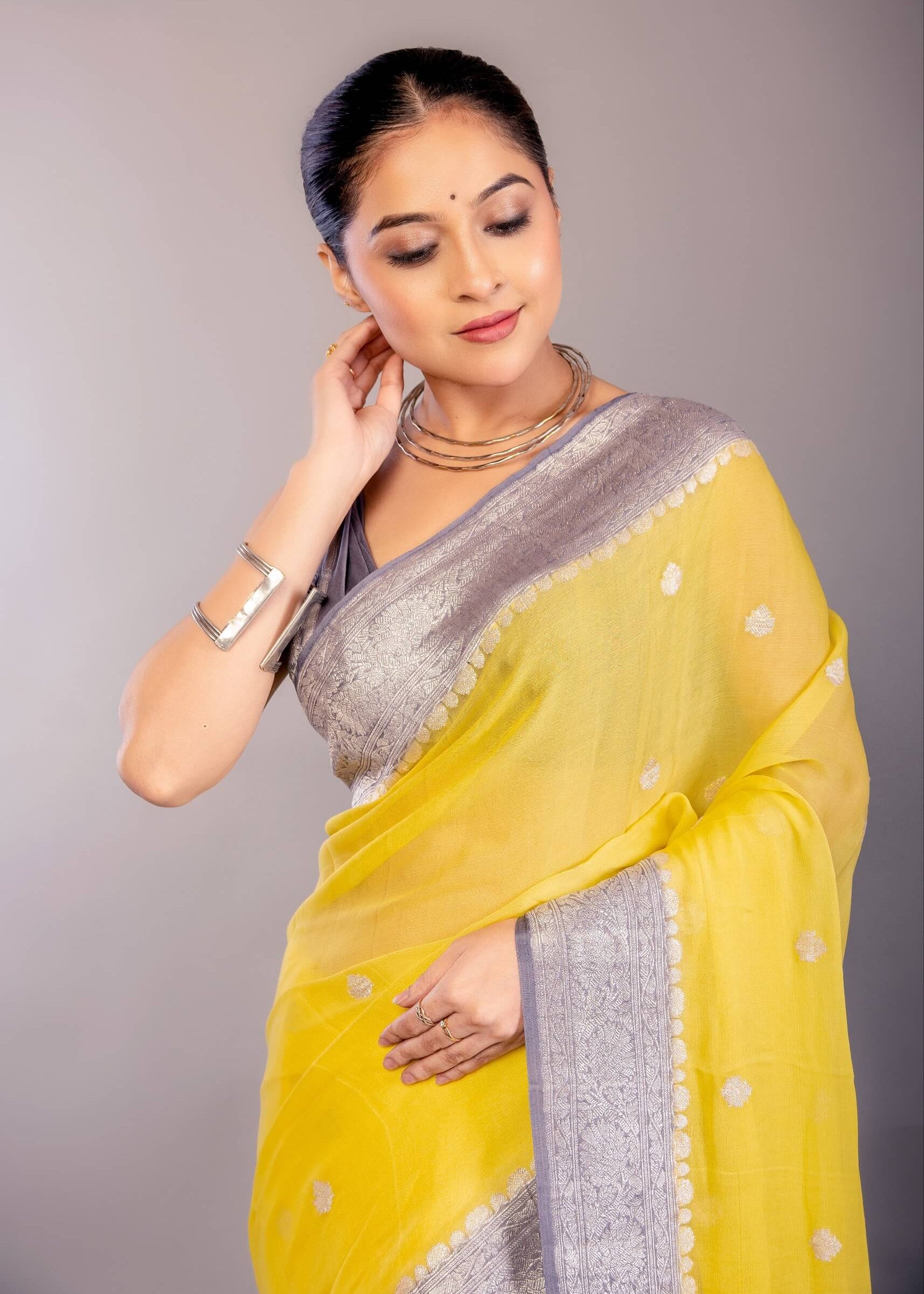 Yellow Khaddi Georgette Banarasi Saree with Contrasting Gray Zari Border - Anvi Couture