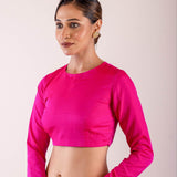 A woman dressed in a Rani Pink Full Sleeve Formal Blouse with High Neck- Elegant Workwear Essential for Women - Anvi Couture - Image 3