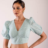 Woman Dressed in a Light Blue Hakoba Blouse with Puff Sleeves and V Neckline- Chic and Casual Premium Quality Ethnic Wear: Best Fittings - Anvi Couture - Image 3