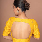 A Woman Wearing a Yellow Raw Silk Blouse with Boat Neckline and Gold Floral Work: Anvi Couture - Image 5