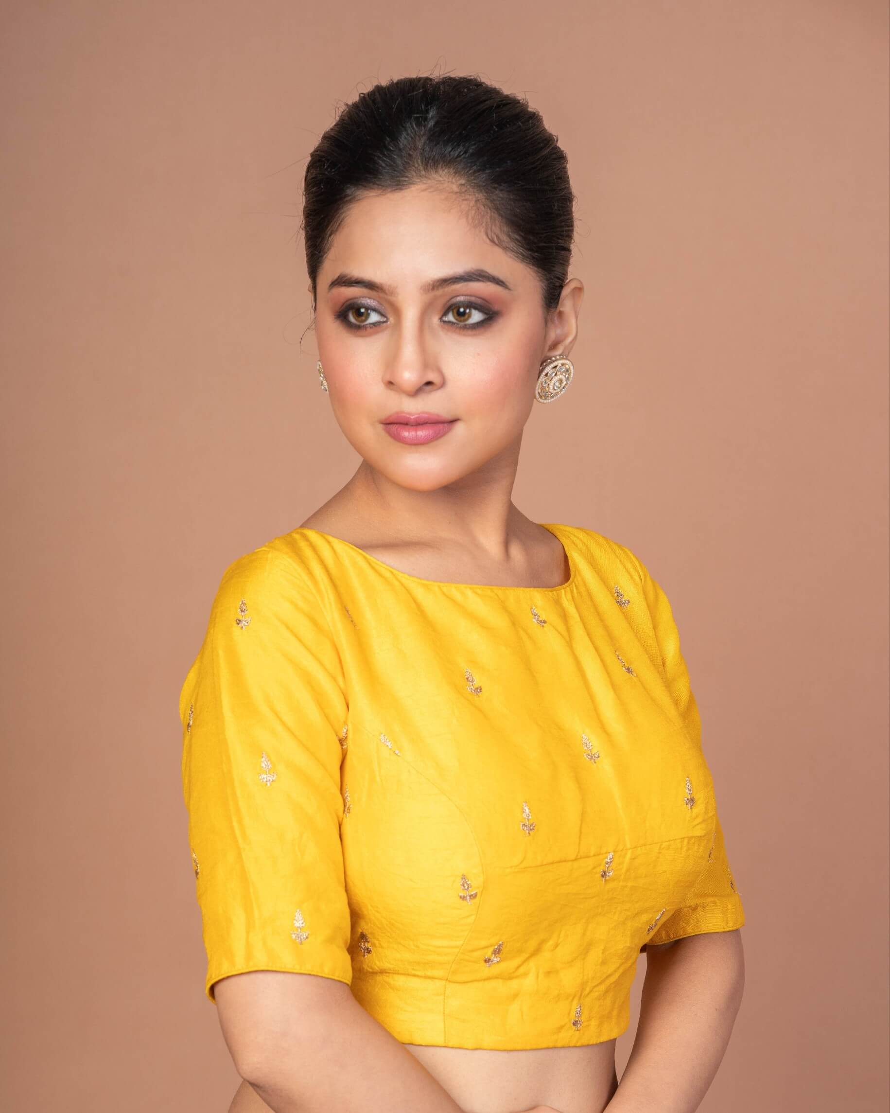 Woman wearing a Yellow Raw Silk Blouse with Boat Neckline and Gold Floral Work: Anvi Couture - Image 3