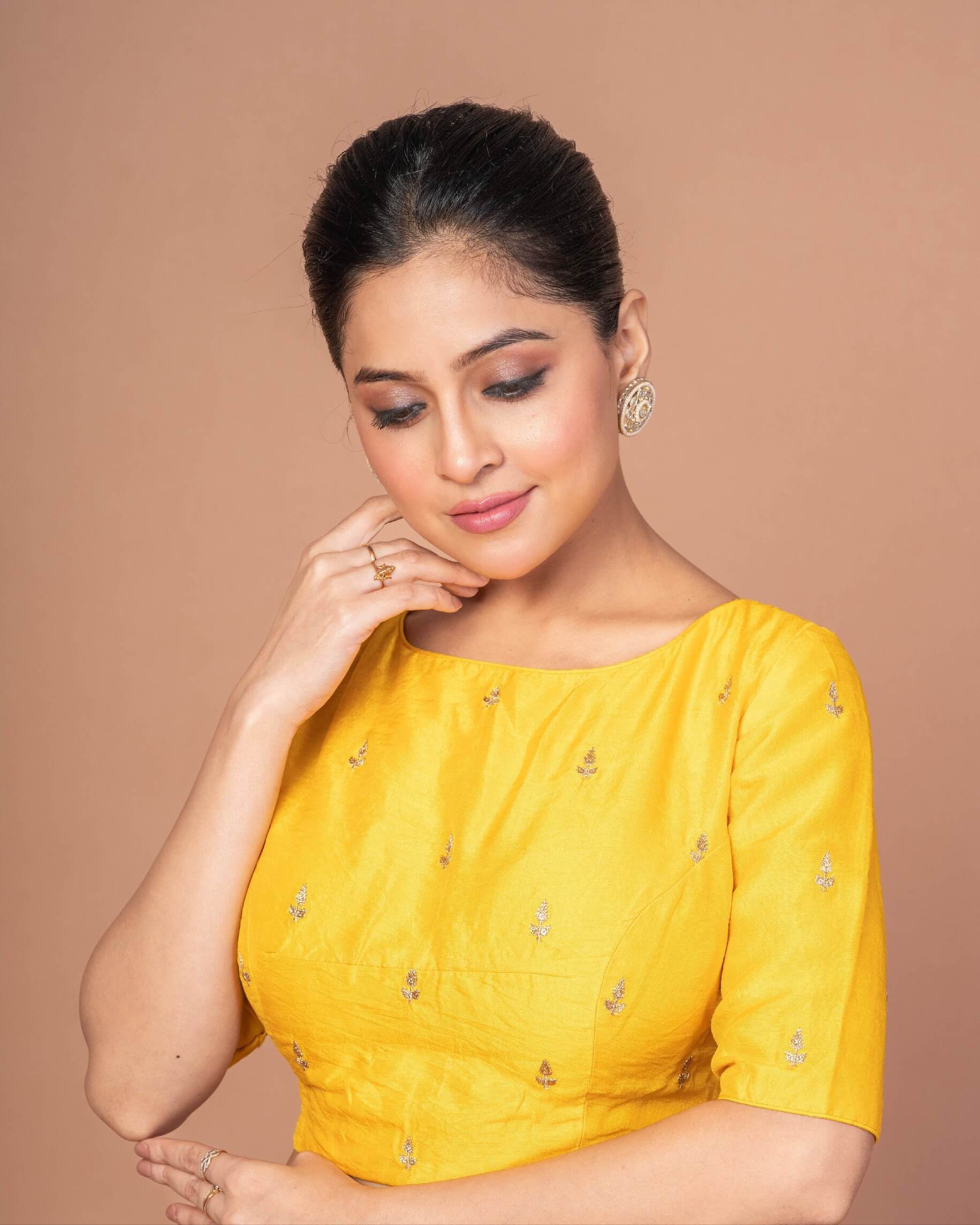 A Woman Wearing a Yellow Raw Silk Blouse with Boat Neckline and Gold Floral Work: Festive Wear Blouse - Anvi Couture - Image 4