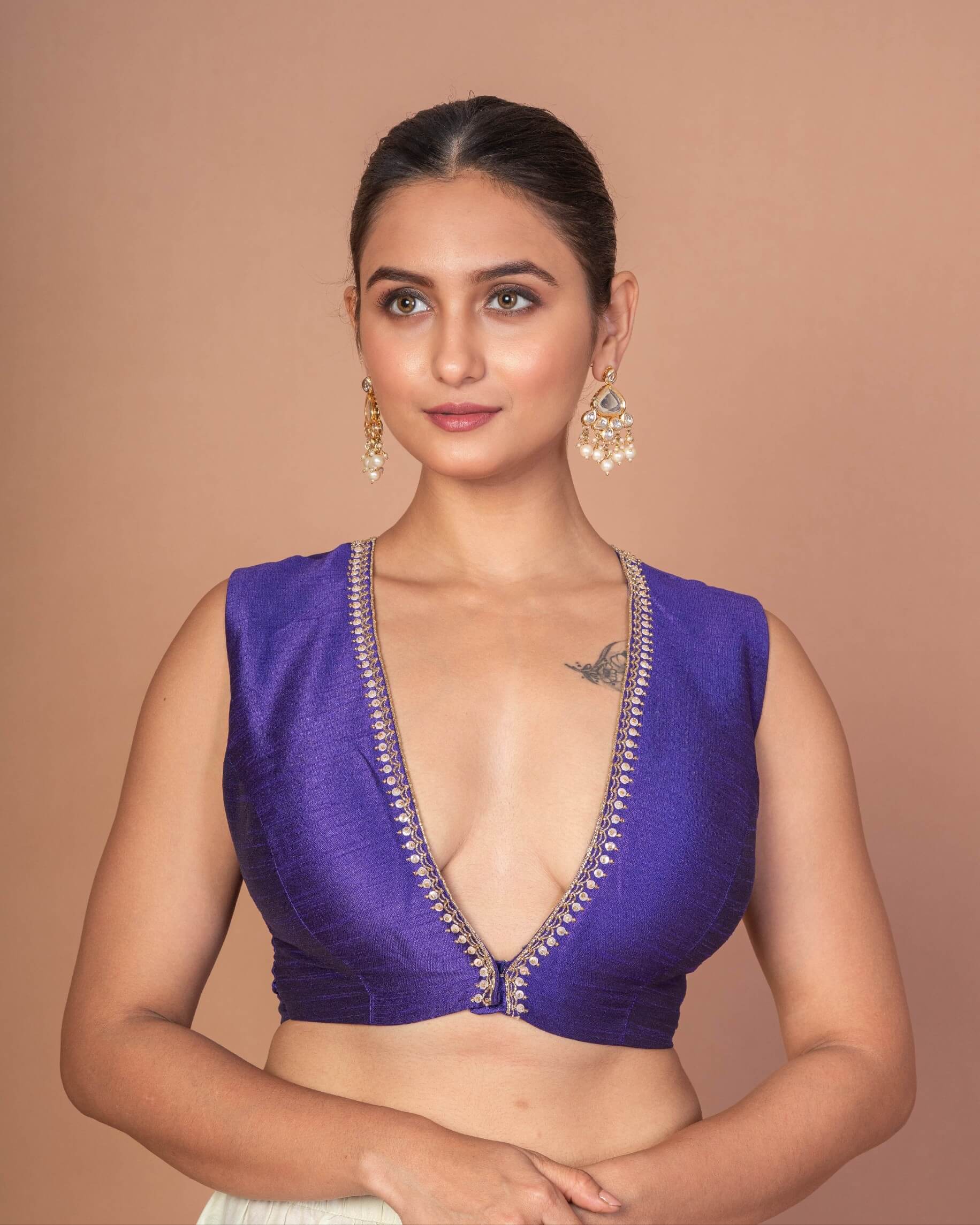 Woman Wearing a Royal Blue V-Neckline Sleeveless Blouse with Embroidered Work: Anvi Couture - Image 2