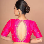 Woman Wearing a Hot Pink Hand Embroidered Blouse in Raw Silk with Boat Neckline and Back cutout: Bridal Blouse - Anvi Couture - Image 4