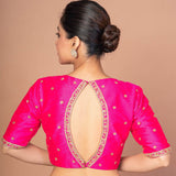 Woman Wearing a Hot Pink Hand Embroidered Blouse in Raw Silk with Boat Neckline and Back cutout: Bridal Blouse - Anvi Couture - Image 4