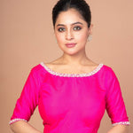 Woman Wearing a Rose Pink Silk blouse with Pearl Embroidered Work with Boat Neck and Back cutout: Anvi Couture - Image 1