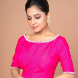 Woman Dressed in a Rose Pink Silk blouse with Pearl Embroidered Work with Boat Neck and Back cutout: Anvi Couture - Image 3