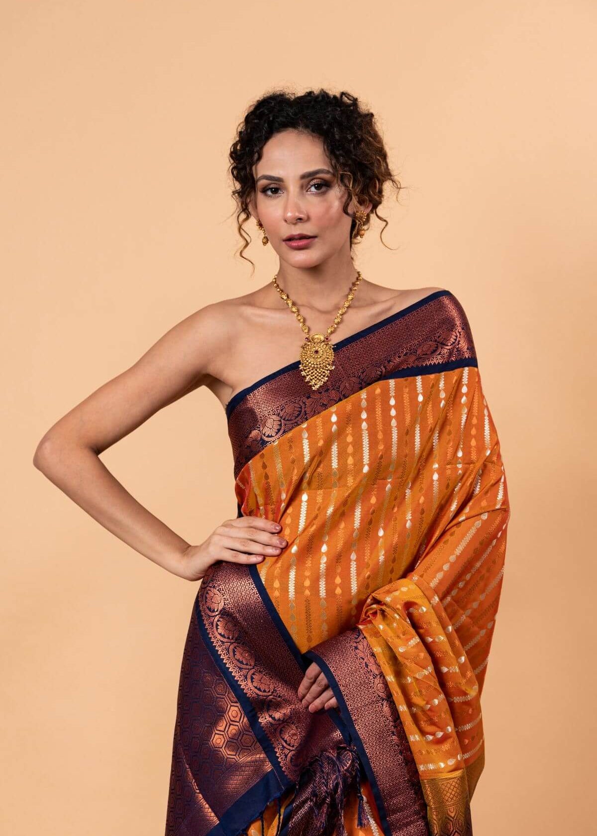 Orange Kanjivaram Silk Saree with Copper and Blue Border and Pallu - Anvi Couture