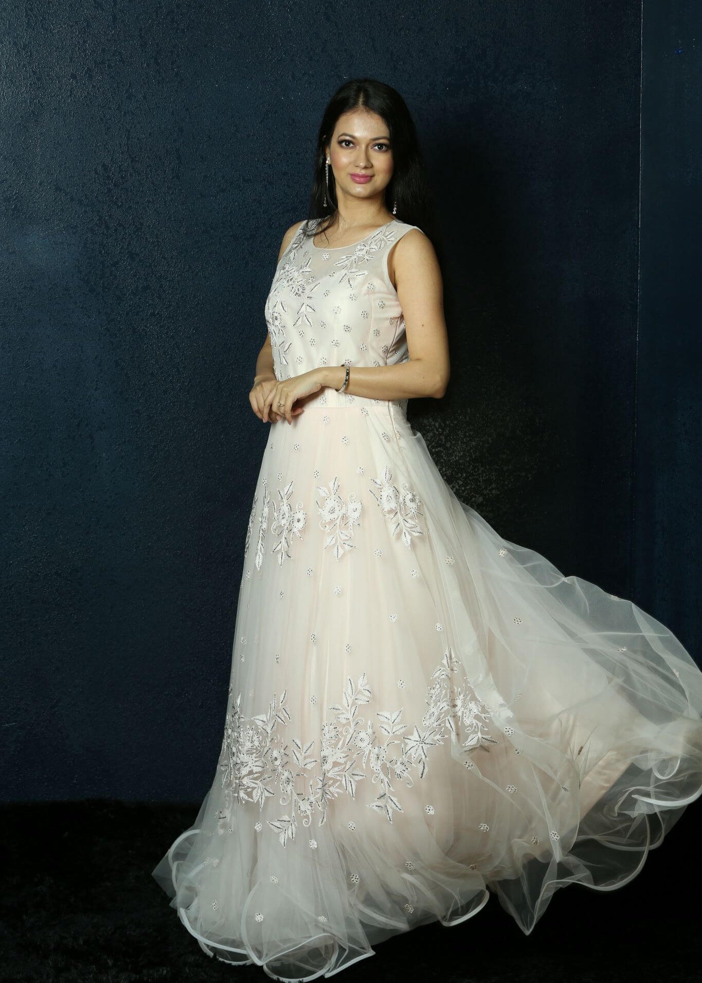 Light Pink Net gown adorned with Swarovski work