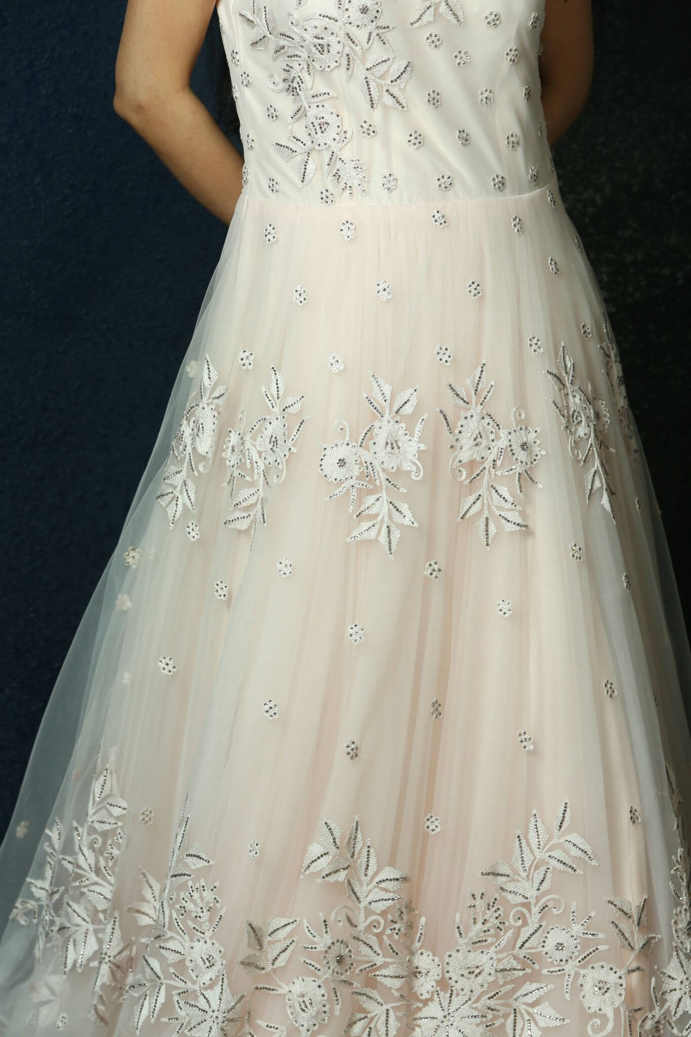 Light Pink Net gown adorned with Swarovski work