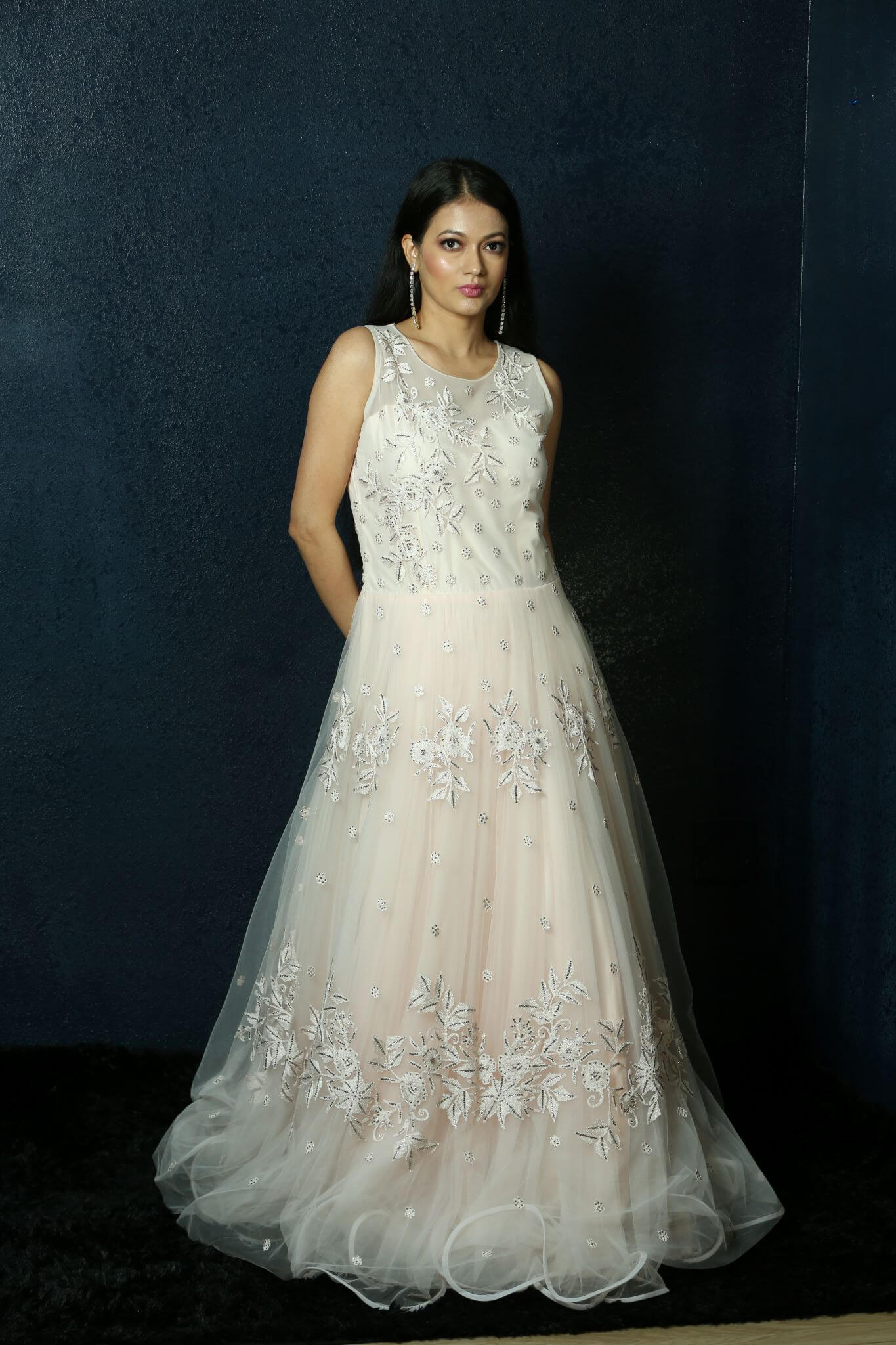 Light Pink Net gown adorned with Swarovski work